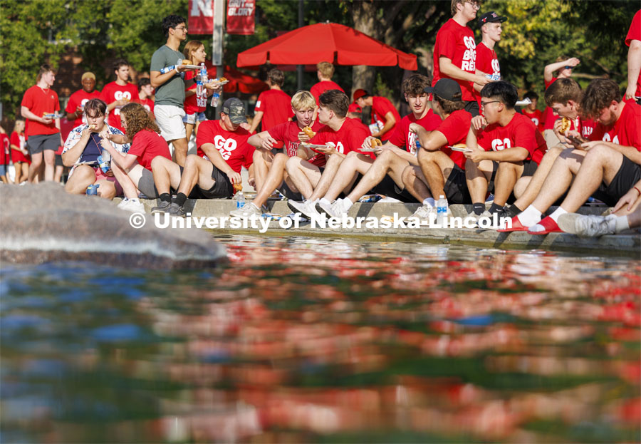 The Class of 2028 students sit by Broyhill Fountain for a sit-down meal at the Chancellor’s BBQ. August 23, 2024. Photo by Craig Chandler / University Communication and Marketing.