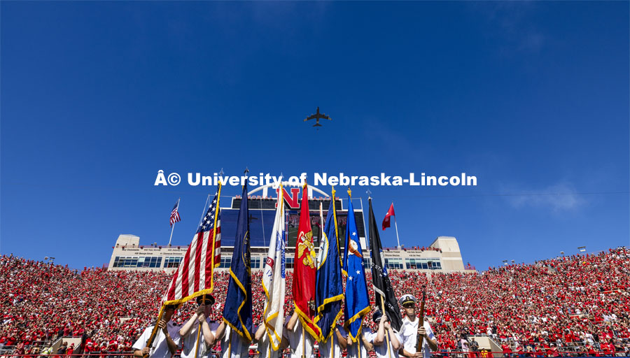 A KC-135 with Nebraska Air National Guard’s 173rd Air Refueling Squadron performs a flyover for the Nebraska vs UTEP football game. The stripes on the plane commemorate James Kunkle, a 101-year-old pilot who is the oldest living pilot in the units’ long history. Kunkle served as a U.S. Army Air Corps pilot during World War II and flew P-38 and P-57 aircraft. Kunkle received the Distinguished Service Cross for engaging 20 German aircraft and downing two of them. The stripes are the same pattern Kunkle’s P-38 wore during the D-Day invasion. August 31, 2024. Photo by Craig Chandler / University Communication and Marketing.