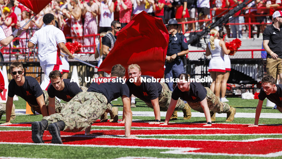 The ROTC does push-ups for points at the Nebraska football game vs UTEP. August 31, 2024. Photo by Craig Chandler / University Communication and Marketing.