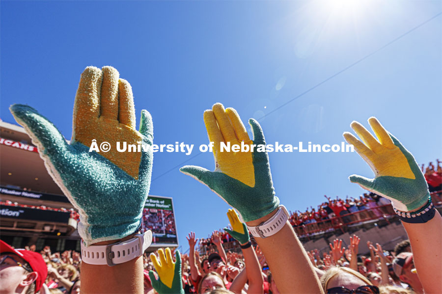 A group in the student section show off their "corn hands". Nebraska football game vs UTEP. August 31, 2024. Photo by Craig Chandler / University Communication and Marketing.