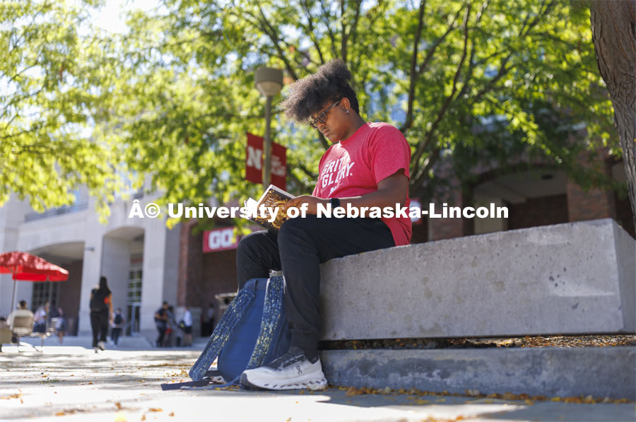 Nathan Bullard, a second-year student from Gretna, studies on the Nebraska Union plaza. Students on city campus. September 3, 2024. Photo by Craig Chandler / University Communication and Marketing.