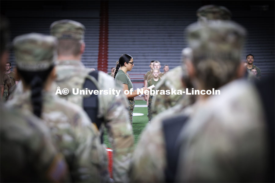 NROTC Midshipman Gabrielle Martinez reads a proclamation honoring the victims of 9/11 before the groups climbed the stairs. 9/11 stair climb in Memorial Stadium to commemorate September 11, 2001. September 11, 2024. Photo by Craig Chandler / University Communication and Marketing.