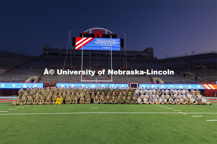 Group photo of the Army and Air Force cadets and Navy and Marine midshipmen on the field in Memorial Stadium. 9/11 stair climb in Memorial Stadium to commemorate September 11, 2001. September 11, 2024. Photo by Craig Chandler / University Communication and Marketing.