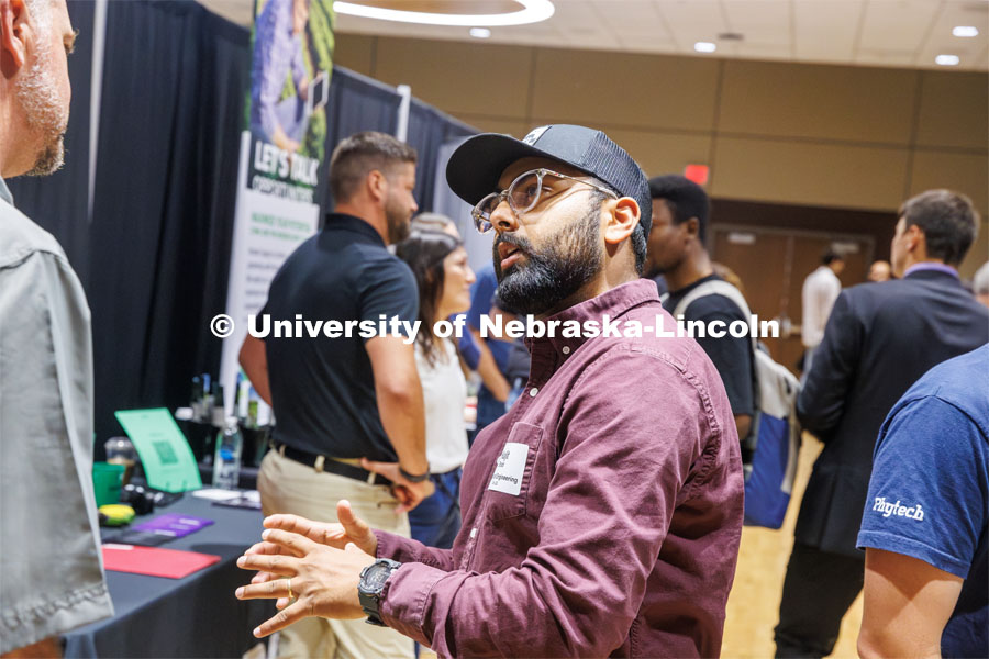 Kuljit Bhatti, a Biological Engineering graduate student talks with Chad Gross with Five Rivers Cattle Feeding at the East Campus Career Fair. September 16, 2024. Photo by Kristen Labadie / University Communication.