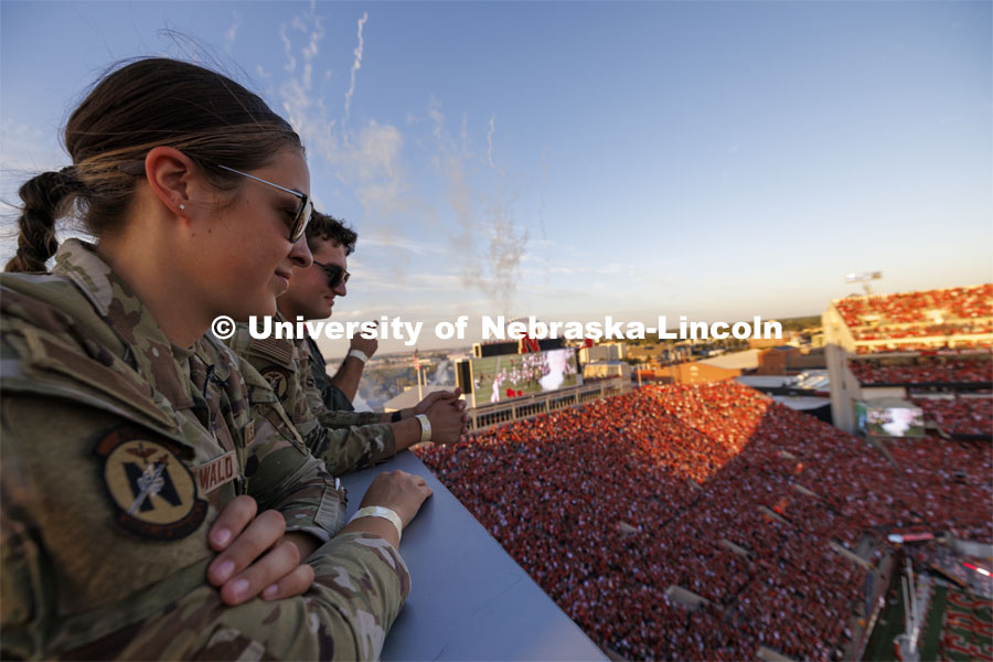 Air Force ROTC cadets Elena Burgwald and Mason Beck watch the tunnel walk from the roof of west stadium after the successful flyover. Nebraska vs. Illinois football game. September 20, 2024. Photo by Craig Chandler / University Communication and Marketing.