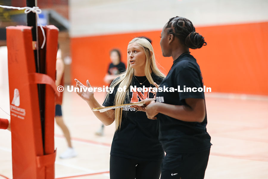 Kaila Lorence, UNL Senior majoring in Speech Pathology, officiating an intramural volleyball game in the Coliseum. October, 1, 2024. Photo by Taryn Hamill for University Communication and Marketing.