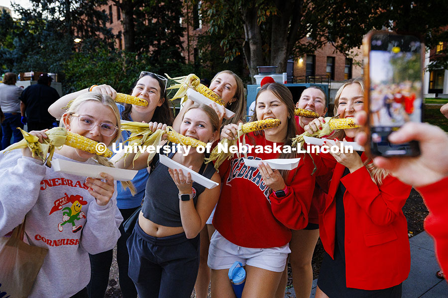 Gamma Phi Beta sorority sisters act corny for a photo at Cornchella Homecoming Parade and Cornstock. October 4, 2024. Photo by Craig Chandler / University Communication and Marketing.