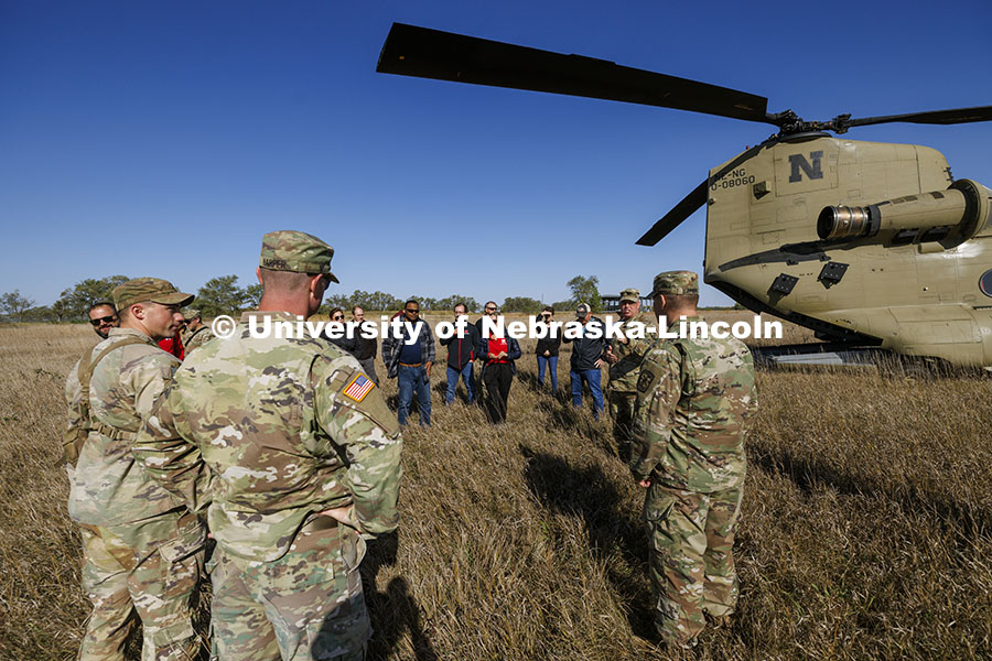 UNL advisors and professors listen to Lt. Col. Tom Slykhuis talks about the day’s field exercise with ROTC cadets. ROTC cadets on fall exercise. October 4, 2024. Photo by Craig Chandler / University Communication and Marketing.