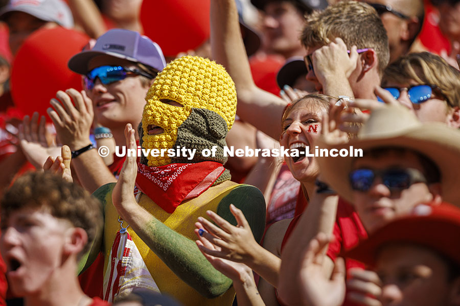 Ryan Jensen, a senior from Lincoln, wore his own version of a corn head knitted by his girlfriend, Emmy Oldham of Wellfleet, Nebraska. Jensen said it felt about 20 degrees hotter inside the headgear. Nebraska vs Rutgers football game. Homecoming game. October 5, 2024. Photo by Craig Chandler / University Communication and Marketing.