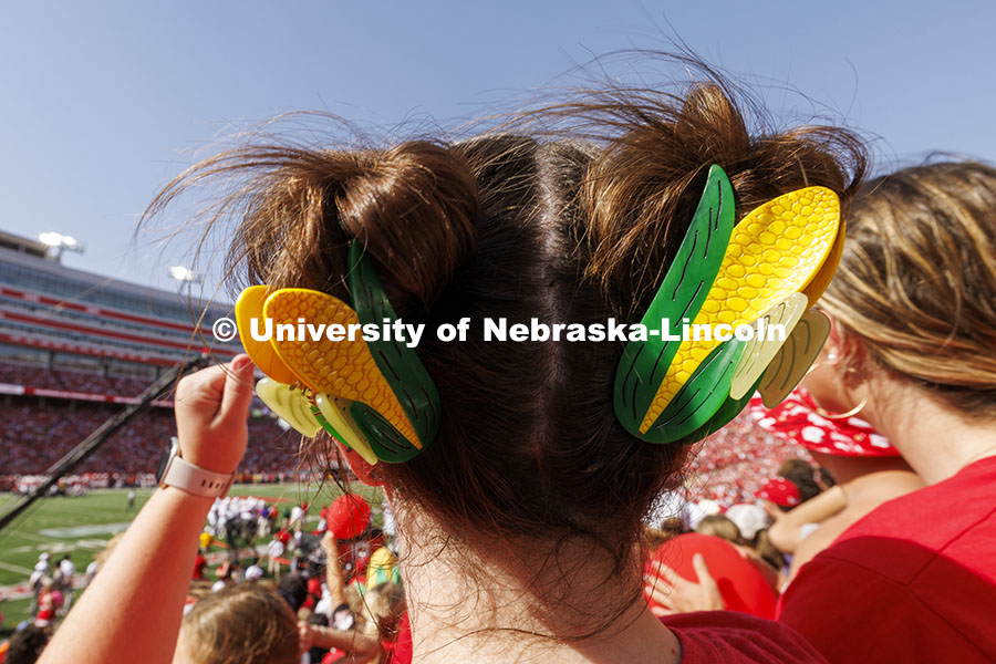 Ellie Dunn wears corn hair clips to cheer the Huskers. Nebraska vs Rutgers football game. Homecoming game. October 5, 2024. Photo by Craig Chandler / University Communication and Marketing.