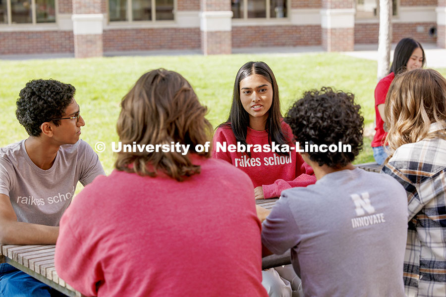 Students socializing outside the Raikes Center. Raikes School photoshoot. October 9, 2024. Photo by Craig Chandler / University Communication and Marketing.