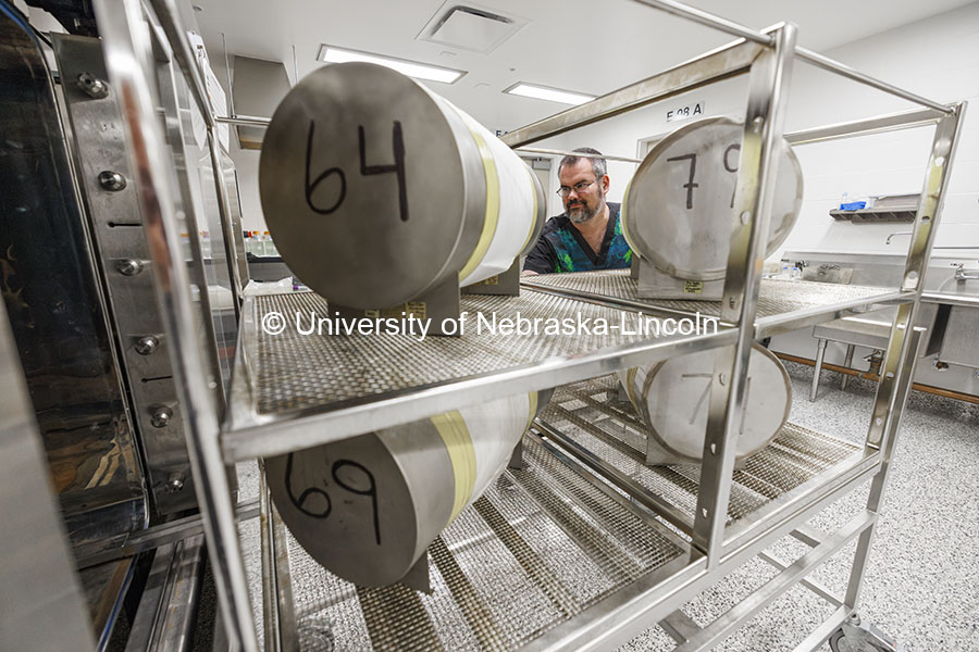 Jeffrey Price, Associate Director, Nebraska Gnotobiotic Mouse Program, uses an autoclave to sterilize supply cylinders containing food and bedding for the mice. Nebraska Gnotobiotic Mouse Program. October 16, 2024. Photo by Craig Chandler / University Communication and Marketing.