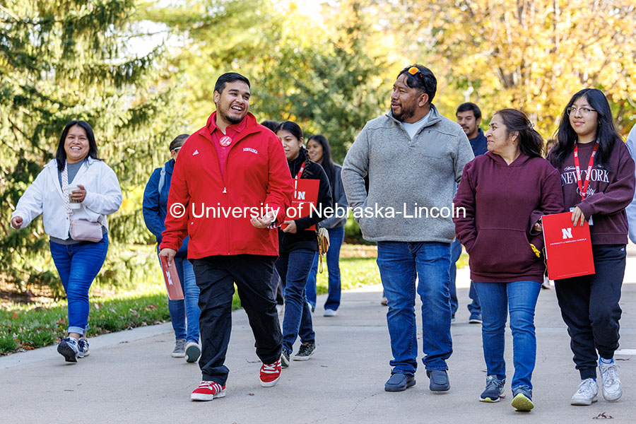 NSE student ambassador Jhovany Millan, center-left, speaks with families as they take a campus tour during Spanish Visit Day. October 26, 2024. Photo by Jordan Opp / University Communication and Marketing.