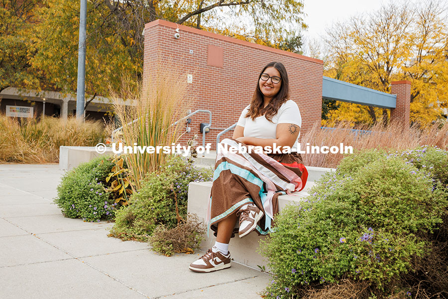 Kacyn Harlan, a Sports Media and Communication, and an Advertising and Public Relations double major poses outside the College of Journalism for Native American Heritage Month.  October 28, 2024. Photo by Kristen Labadie / University Communication.