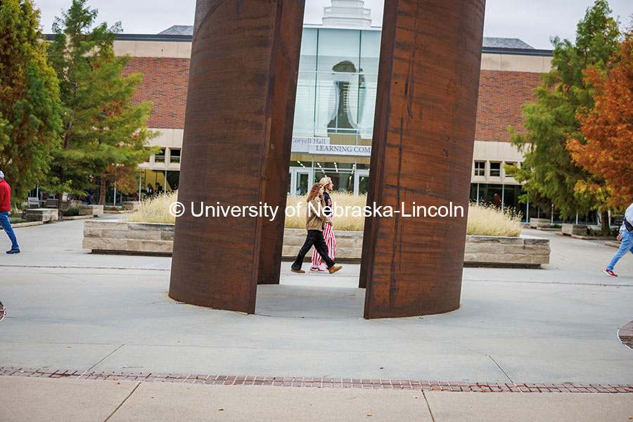 Husker fans cross campus near the Adele Coryell Hall Learning Commons on their way to the Nebraska vs UCLA football game. November 2, 2024. Photo by Kristen Labadie / University Communication.