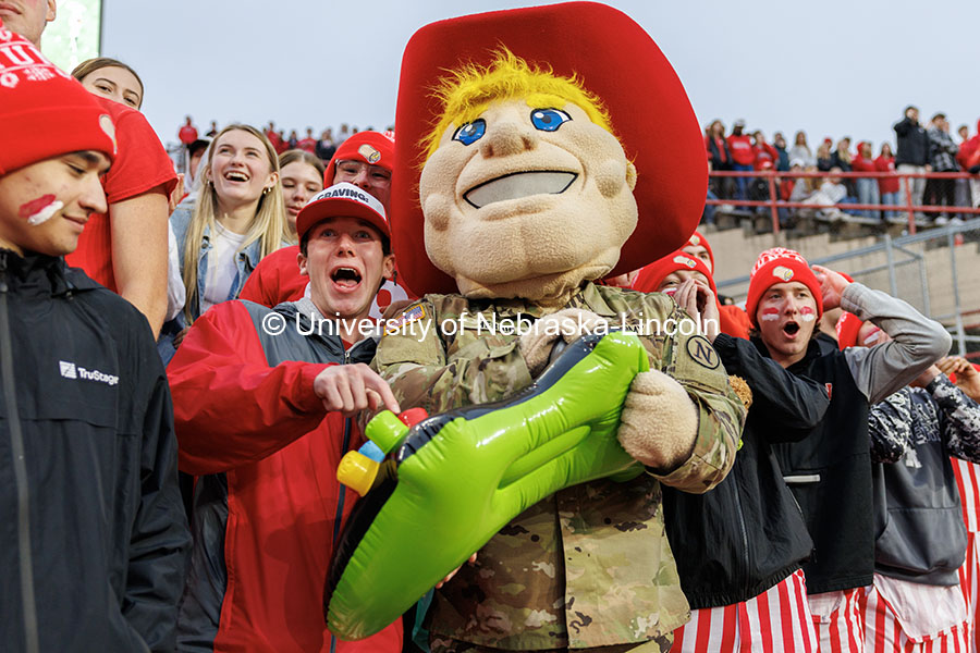 Tom Dey and Herbie Husker use a controller to get help force a UCLA fourth down in the fourth quarter. Nebraska vs UCLA football game. November 2, 2024. Photo by Jordan Opp / University Communication and Marketing.