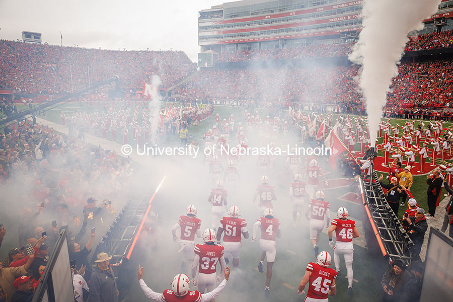 The Husker football team runs onto the field at the Nebraska vs UCLA football game. November 2, 2024. Photo by Kristen Labadie / University Communication.