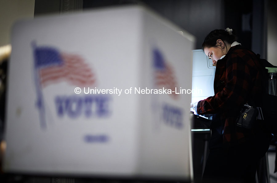 First-time voter Emma Grafton, a junior in psychology, votes at a booth in the Nebraska Union’s Corn Crib. Voting in the Nebraska Union for the 2024 Presidential Election. November 5, 2024. Photo by Craig Chandler / University Communication.