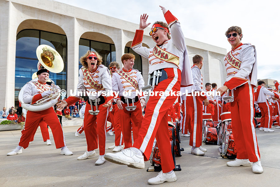 Members of the Cornhusker Marching Band bring the energy during their concert outside the Sheldon Museum of Art. Nebraska vs. Wisconsin football game. November 23, 2024. Photo by Jordan Opp / University Communication and Marketing.