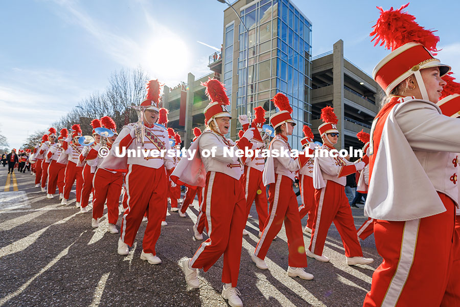 The Cornhusker Marching Band marches up Stadium Drive as the enter Memorial Stadium. Nebraska vs. Wisconsin football game. November 23, 2024. Photo by Jordan Opp / University Communication and Marketing.