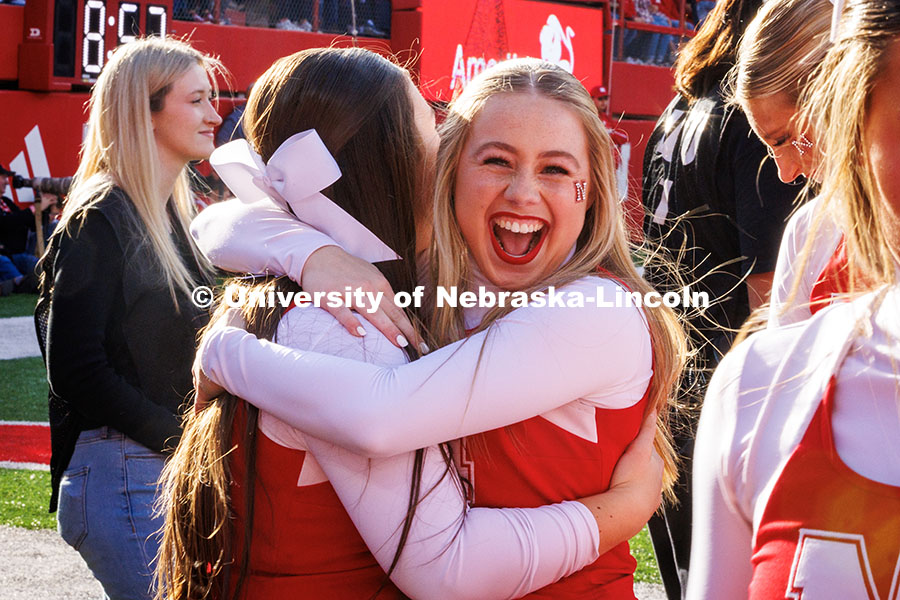 Haili Foster, a sophomore Husker Cheerleader, hugs her friend on the cheer squad after performing a successful cheerleading stunt. November 23, 2024. Photo by Kristen Labadie / University Communication.