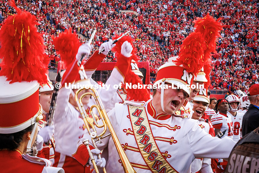 A band member cheers while waiting to perform during halftime at the Huskers vs. Wisconsin football game. November 23, 2024. Photo by Kristen Labadie / University Communication.