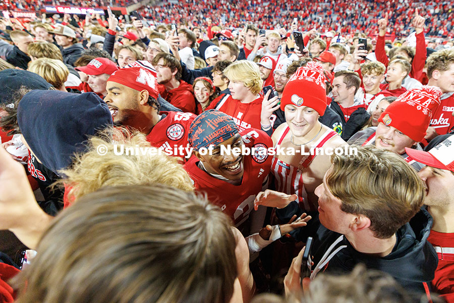 Husker fans storm the field following the team’s 44-25 win over Wisconsin to secure bowl game eligibility. Nebraska vs. Wisconsin football game. November 23, 2024. Photo by Jordan Opp / University Communication and Marketing.