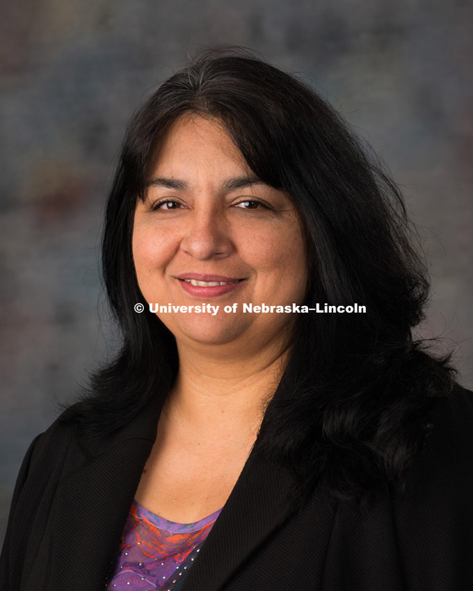 Studio portrait of Sandra Barrera Fuentes, New Faculty Photo Shoot, August 19, 2015. 