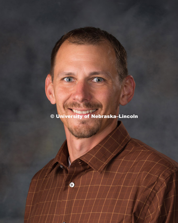 Studio portrait of Jesse Korus, New Faculty Photo Shoot, August 19, 2015. 