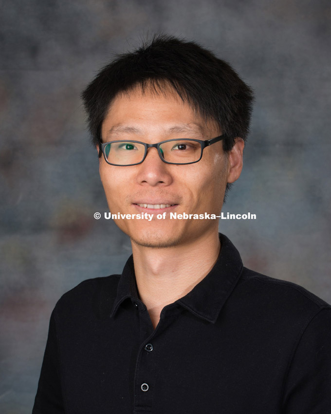 Studio portrait of Zhong Zhang, New Faculty Photo Shoot, August 19, 2015. 