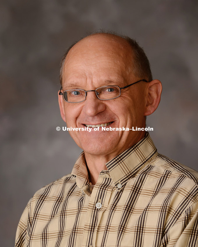 Studio portrait of Andrzej Rajca, one of eight University of Nebraska-Lincoln faculty members named 