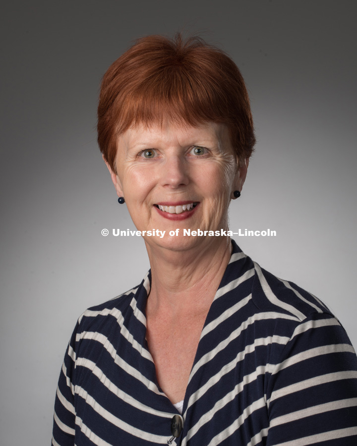 Studio portrait of Debra Pearson, Library faculty/staff photo for web. May 4, 2016. 