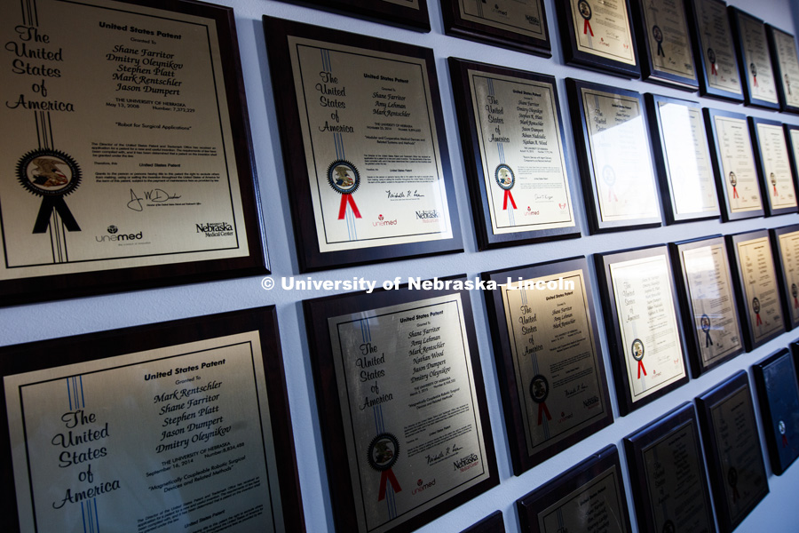 The conference room wall is filled with patents that are part of the Virtual Incision technology. Vi