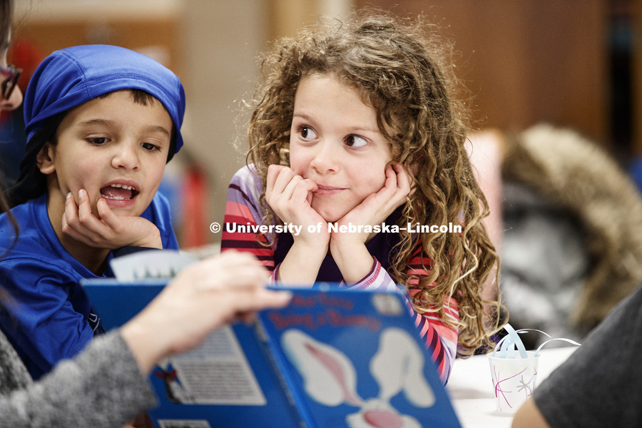 Children listen as Brenda West, accounting technician from the Center for Science, Mathematics and C