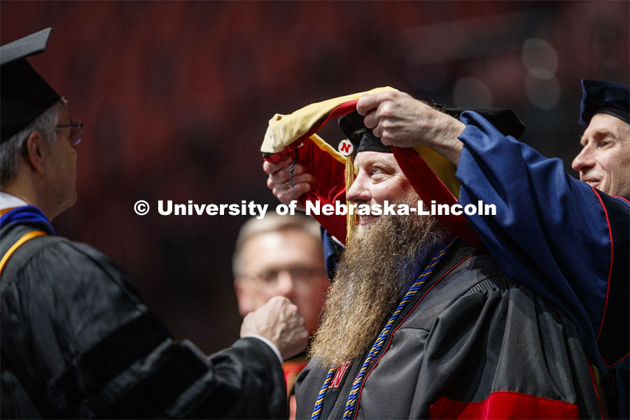 Patrick Janike hugs his advisor Lorraine Males after he received his doctor of education hood. 2019 