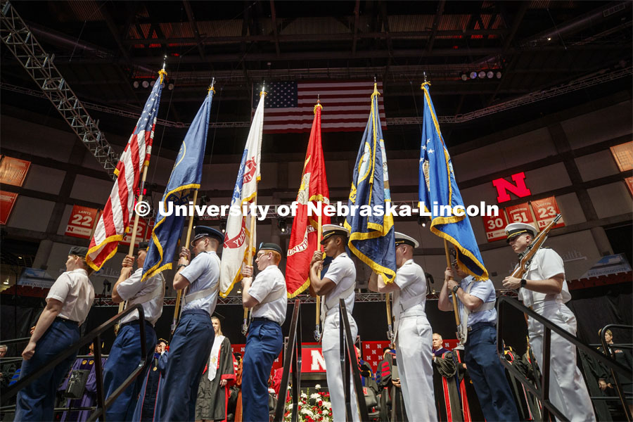 The color guard of the combined ROTC units. Undergraduate commencement at Pinnacle Bank Arena, May 4