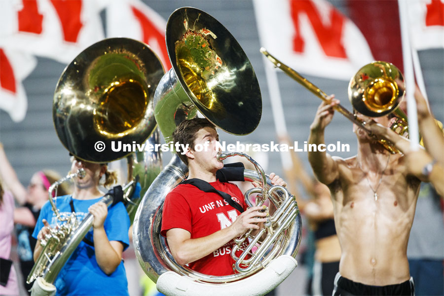 Nick Pavel and the Cornhusker Marching Band goes through their pregame routing during Tuesday evenin