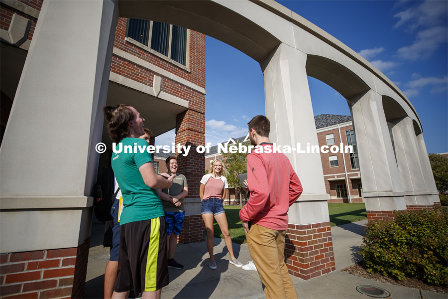 Students hanging out front of the Kauffman Academic Residential Center. Raikes school photo shoot. S