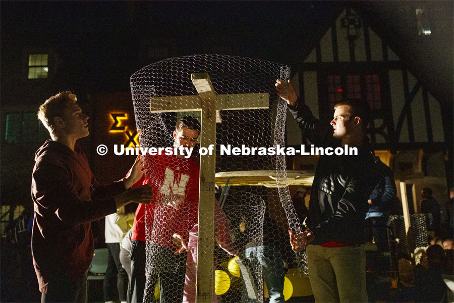 Sigma Chi members, from left, Chad Gratton, Matthew Dutka and Chris Karmazin form the chicken wire i