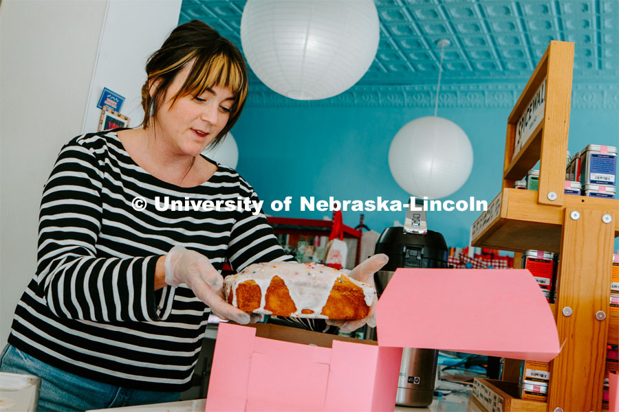 An employee boxes a cake at Goldenrod Bakery. About Lincoln at Goldenrod Bakery. October 17, 2023. 