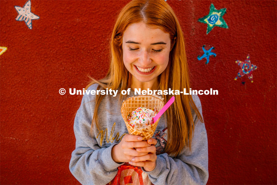 Hannah-Kate Kinney enjoys a waffle cone at Ivanna Cone. About Lincoln at Ivanna Cone in the Haymarke