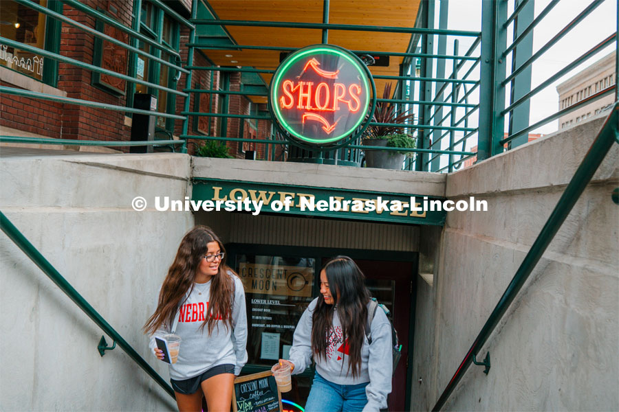 Grace Patel (left) and Isela Tercero browse shops in the Haymarket. About Lincoln at Coffee Shops in