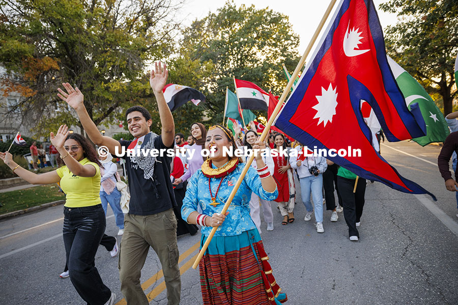 International Students march in the homecoming parade. Cornchella Homecoming Parade and Cornstock. O