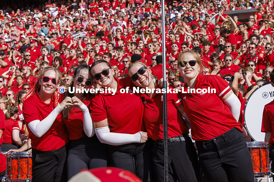 The Cornhusker Marching Band Color Guard pose for a picture at the Nebraska vs Rutgers football game