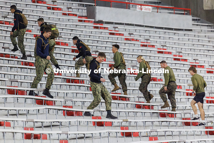 NROTC midshipmen climb flights of east stadium stairs. Navy and Marine Corps 249th birthday celebrat