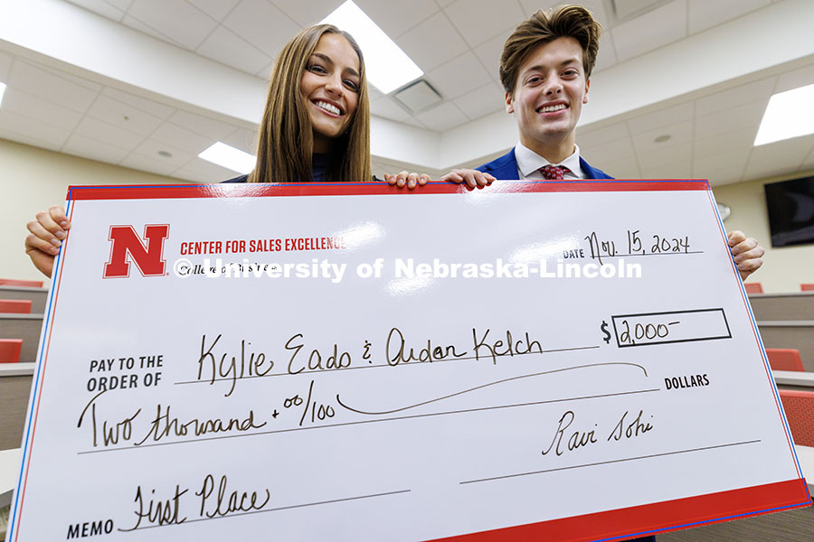 Kylie Eads and Aidan Kelch stand with their first-place check. Fall 2024 Center for Sales Role-Play 