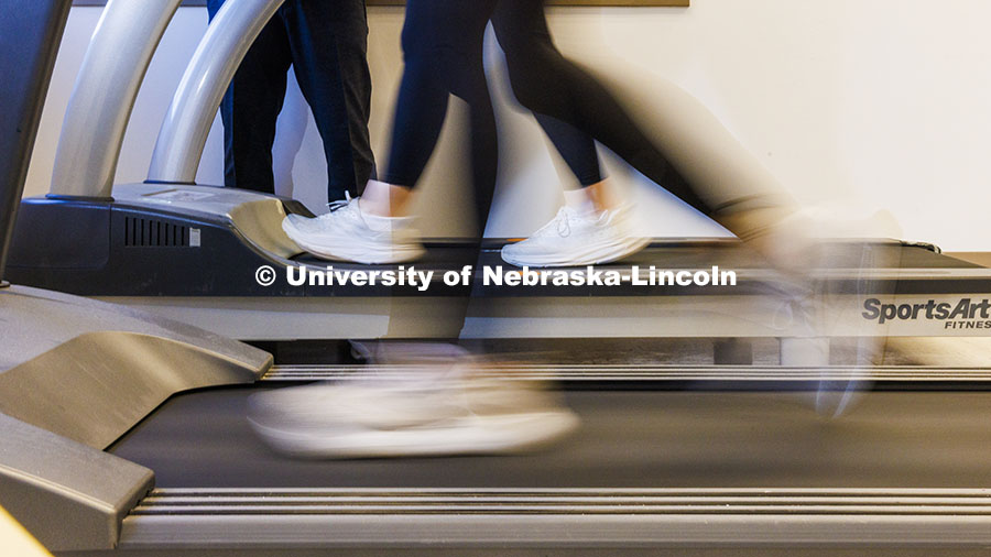 Shinya Takahashi talks with Lauren Marshall as she and Anna Zingler run on treadmills. Takahashi, As