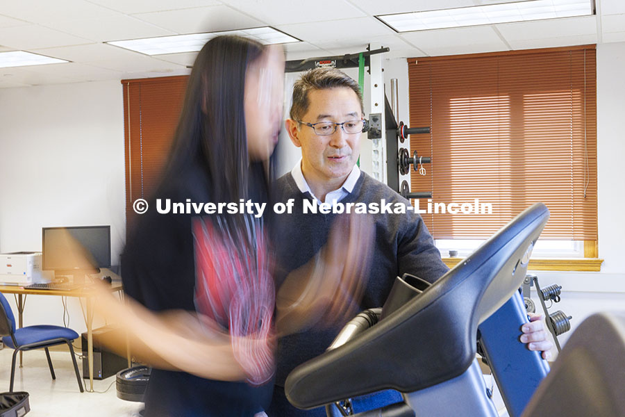 Shinya Takahashi talks with Lauren Marshall as she runs on the treadmill. Takahashi, Associate Profe