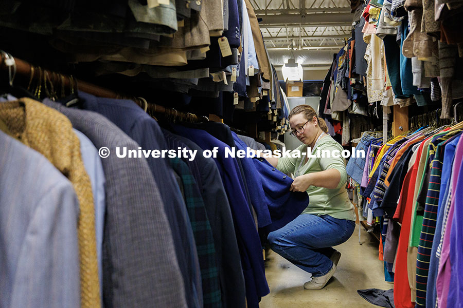 Graduate student Breeanna Pierce looks for the appropriate jacket to use as a costume for a show ins