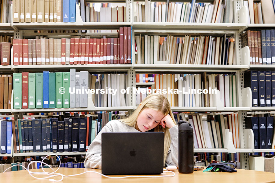 Hailey Olberding, senior, studies inside Love Library during finals week. December 17, 2024. 